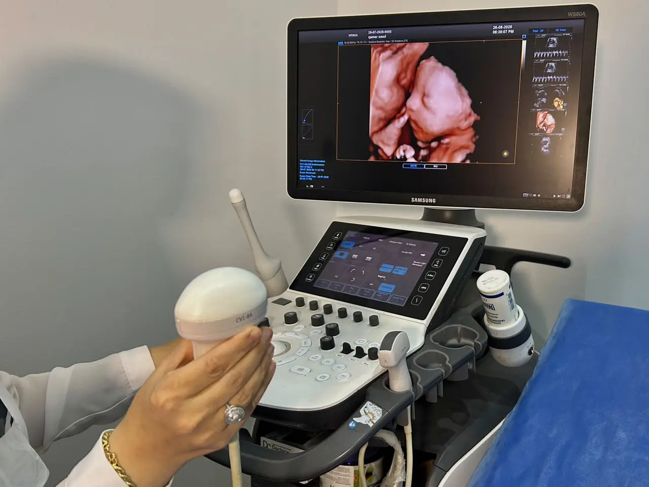 Dr. Doaa Khalifa reviewing an ultrasound scan in clinic